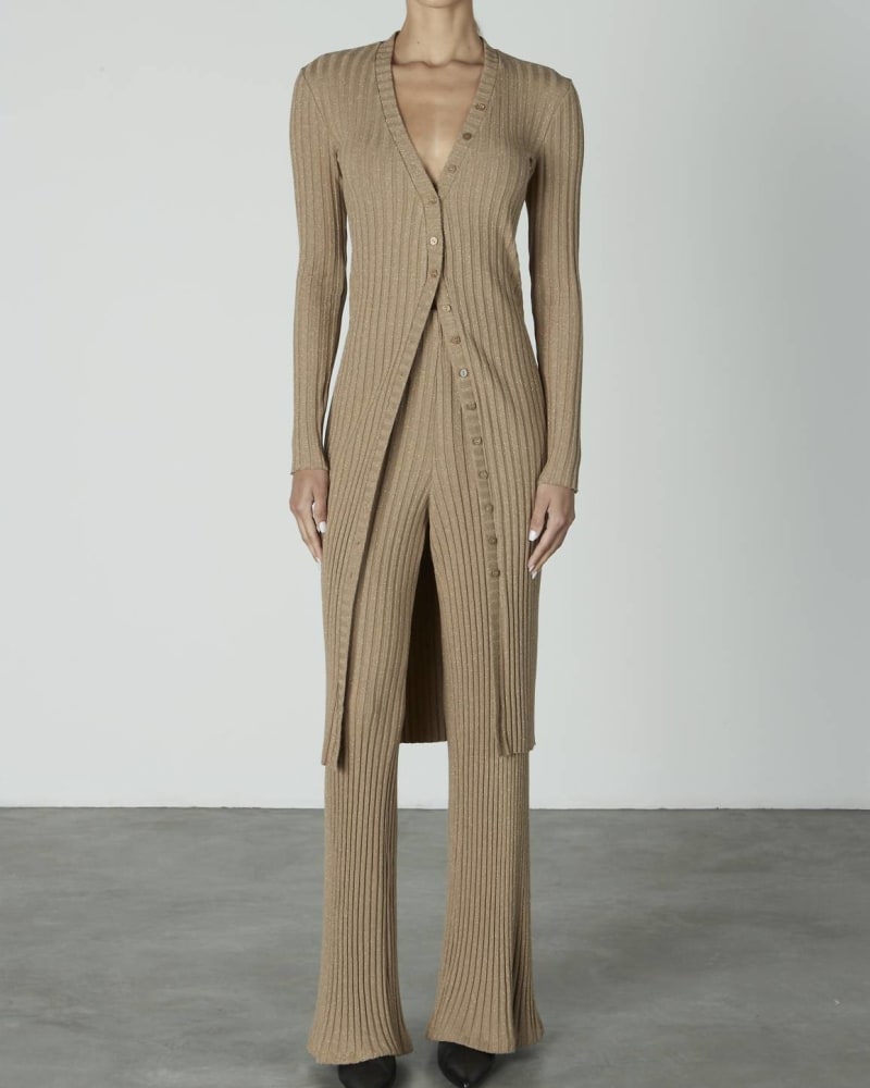 Front of a model wearing a size L Lurex Sweater Rib Flare Pant in Sand/Gold in Sand/Gold by Enza Costa. | dia_product_style_image_id:345309